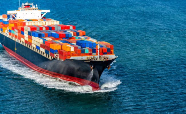 A fully loaded container ship heading to sea through the San Francisco Bay.